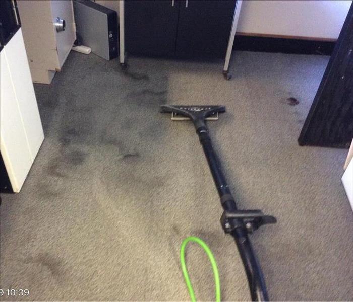 Equipment being used to clean local bank's carpet