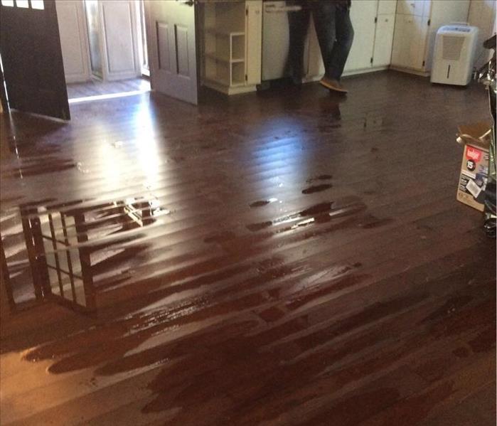 Kitchen floors damaged as a result of a broken water heater