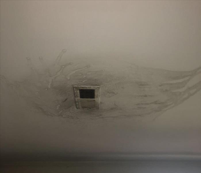 Air vent on ceiling with smoke damage